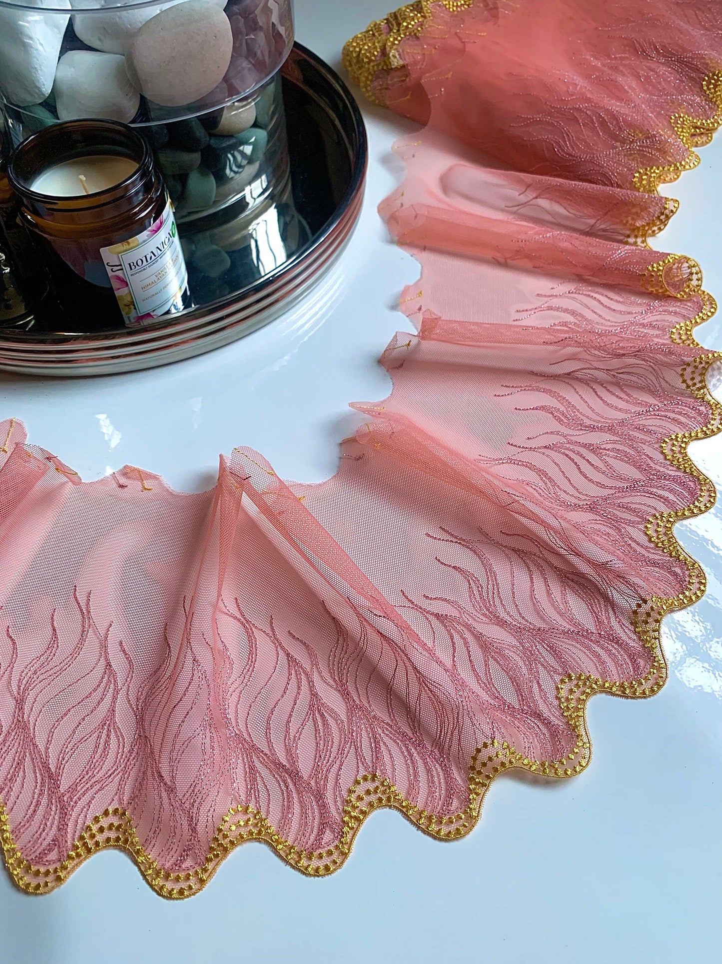 Peach pink swirl shimmer lace with yellow wavy scallop edge.